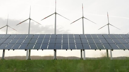 solar panels, windmill, in nature generate electricity from air and sun, renewable alternative energ
