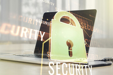 Poster - Double exposure of creative lock hologram with chip on laptop background. Information security concept