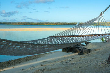 Canvas Print - String hammock slung in shade over tropical beach