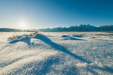 Sun Star And The Teton Mountain Range On A Sunny Day Before Sunset