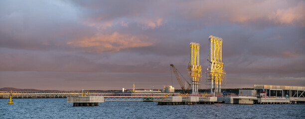 Wall Mural - Newly built LNG terminal photographed during dramatic sunset-panorama