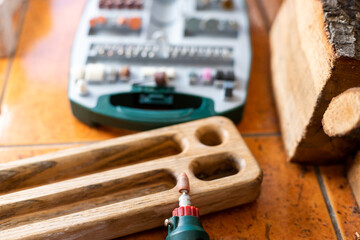 box with accessories for processing and engraving next to an electric tool.