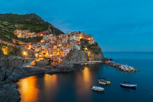Italy, La Spezia, Manarola, View Of Coastal Village In Cinque Terre At Dusk
