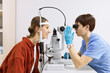 © Westend61 - Ophthalmologist conducting vision diagnostics test with patient at clinic