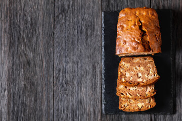 Wall Mural - apple cinnamon bread on slate board, top view