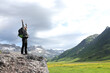 © Antonioguillem - Excited hiker celebrating raising arms