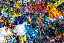 Background - Remnants Of Multicoloured Paint On The Palette