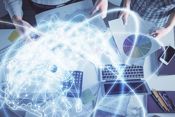 Fototapete - Double exposure of man and woman working together and business theme hologram drawing. Computer background. Top View.