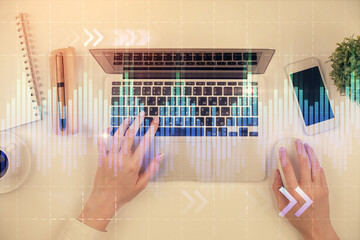 Aufkleber - Double exposure of woman hands working on computer and forex chart hologram drawing. Top View. Financial analysis concept.