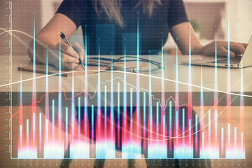 Aufkleber - Double exposure of businesswoman hands typing on computer and forex chart hologram drawing. Financial analysis concept.