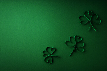 Saint Patrick day flat lay concept with shamrock clover on green background