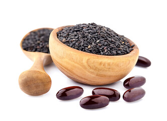 Wall Mural - Black cumin oil pill. Oil capsules. Nigella sativa (Blatsk cumin). Nigella or Black cumin over white background.