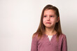 © Gecko Studio - Crying child girl against white background