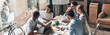 © gstockstudio - Group of young business people discussing strategy while having meeting in the office