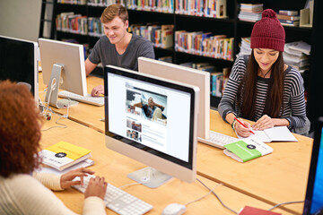 Poster - Fill your mind with knowledge. students working on computers in a university library.
