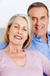 © STEEX/peopleimages.com - Smiling mature woman and man together having a good time. Closeup portrait of a smiling mature woman and man together having a good time.