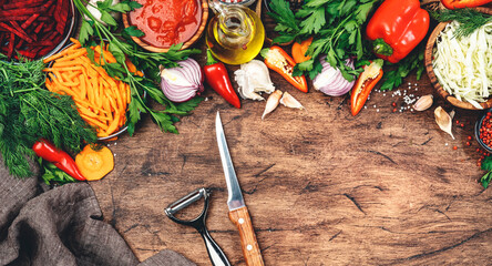 Wall Mural - Various uncooked vegetables, herbs and spices for healthy cooking on rustic kitchen wooden table, top view. Preparation vegetarian cabbage, beetroot, tomato soup. Vegan, balanced, dieting food