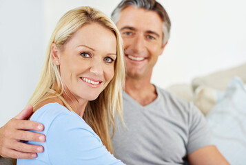 Poster - Life has never been happier. Portrait of a smiling mature couple at home.