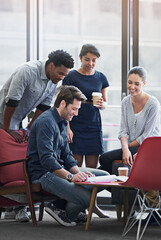Poster - Getting the team motivated. a group of coworkers in a meeting in an office.