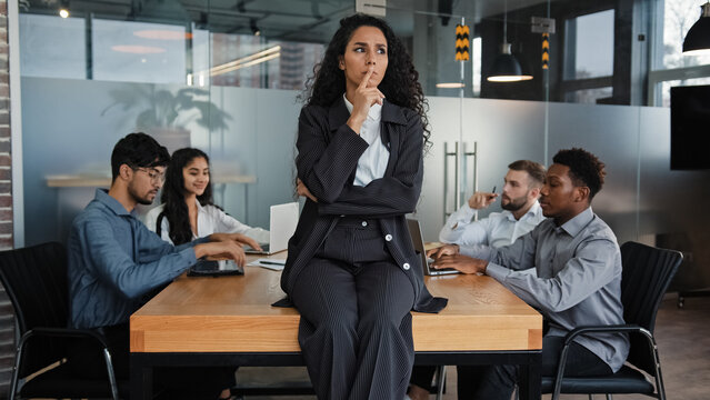 pensive thinking female company ceo thoughtful businesswoman sitting on table office desk in boardro