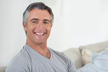 Poster - Who doesnt love the weekend. Portrait of a handsome mature man relaxing at home.