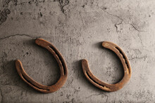Old Grunge Background With Rusty Horseshoes And Copy Space For Western Industry.