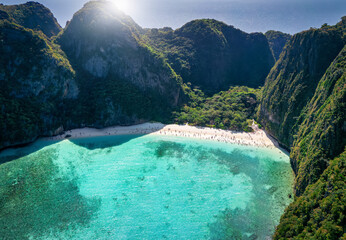 Wall Mural - Aerial view of the famous Maya Beach, Phi Phi islands, Thailand, with turquoise sea shining between the lush mountains