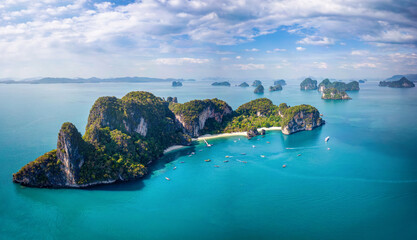 Wall Mural - Panoramic aerial view of the impressive Hong island in Thailand with lush greenhills and golden beaches surrounded by emerald sea
