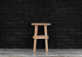 Sticker - wooden rustic stool on a wooden floor