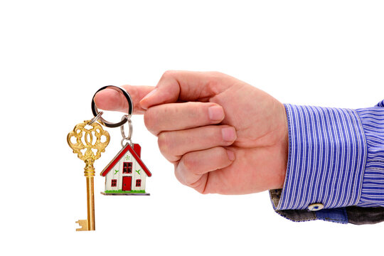Fototapete - isolated home key in hand over transparent background