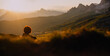 © unigraphy - Berg-Panorama in den Alpen bei Sonnenuntergang im Sommer mit Silhouette einer sitzenden Frau
