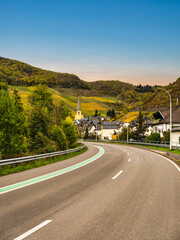 Wall Mural - Senheim village houses on a winding road and steep vinyards during autumn in Cochem-Zell district, Germany