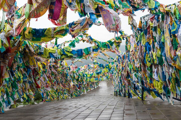 Flags of good luck,buddhist prayer flags with mantras on special metal structures, fluttering in wind. Buddhist datsan Rinpoche Bagsha on mount Lysaya, Ulan-Ude, Buryatia, Russia