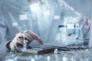 Poster - Double exposure of man hands holding a credit card and envelop fly drawing. E-mail and E-commerce pay on-line concept.