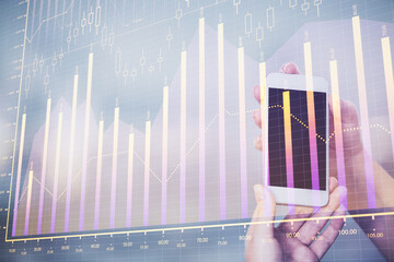 Poster - Double exposure of forex graph sketch hologram and woman holding and using a mobile device. Stock market concept.