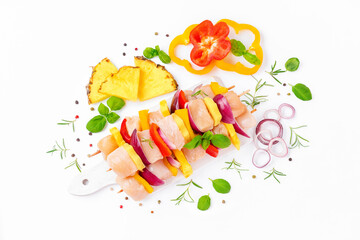 Wall Mural - Skewers with pieces of raw meat, red, yellow pepper.Top view.Chicken Skewers breast fillet meat.Uncooked meat skewer.Raw pieces of chicken skewers with pepper onion and pineapple white background.