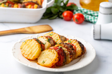 Wall Mural - Traditional Turkish food; baked potatoes and meatballs. Turkish name; kofteli patates dizmesi, patates dizme