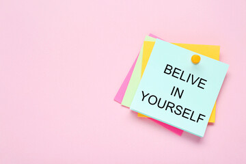Wall Mural - Notes with phrase Believe In Yourself and space for text on pale pink background, top view. Motivational quote