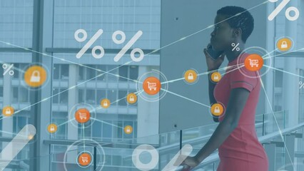 Poster - Animation of percentage symbols over african american businesswoman talking on smartphone at office