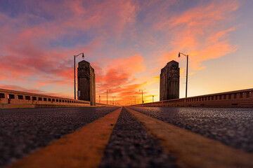 Wall Mural - Guardian statues on the bridge at sunset