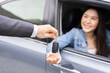 Business car rental, sell or buy service, dealership hand of agent dealer, sale man giving auto key of vehicle to customer renter, buyer young woman receiving, client or tenant, transfer automobile.