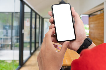 Wall Mural - Man using smartphone at abstract blurred