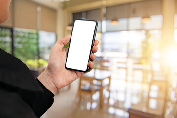 Wall Mural - Man using smartphone at abstract blurred