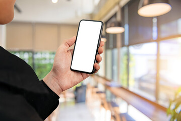 Wall Mural - Man using smartphone at abstract blurred