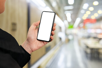 Wall Mural - Man using smartphone at abstract blurred