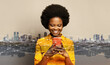 Happy african american businesswoman using smartphone, messaging or browsing social networks Communication, technology,  IoT, internet, global, network, futuristic concept