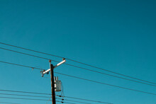 Power Lines Below A Blue Sky In The Summer