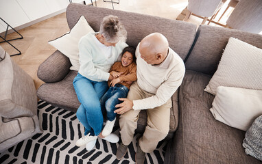 Sticker - Relax, playful and child with grandparents on sofa of living room for bonding, affectionate and embrace. Support, care and break with senior people and boy at home for happiness, generations and hug