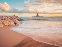 View Of Lighthouse Of Villajoyosa From Beach In The Golden Hour