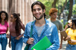 © Daniel Ernst - Laughing latin american male student with group of caucasian and african american young adults